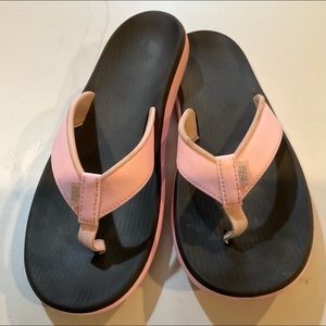 Nike pink/black flip flops. Cute and comfortable!